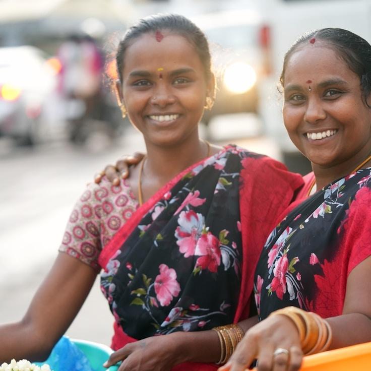 Avery Chen, Lead Design Curator at PioneerKettleLagoon, reviewing corporate floral arrangements